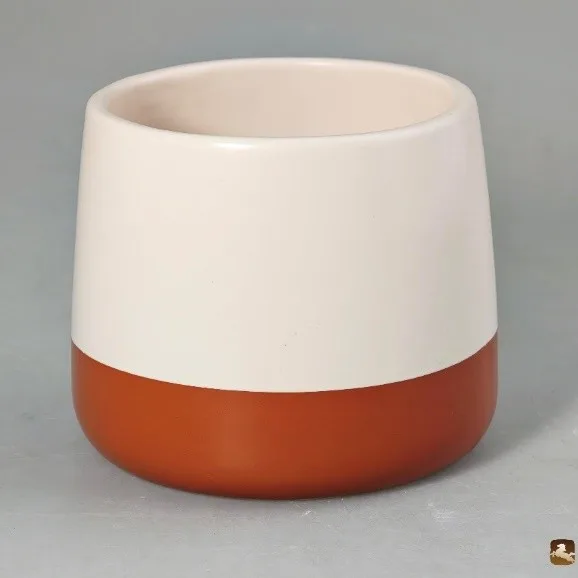Two-tone ceramic vessel, white glaze over terracotta base