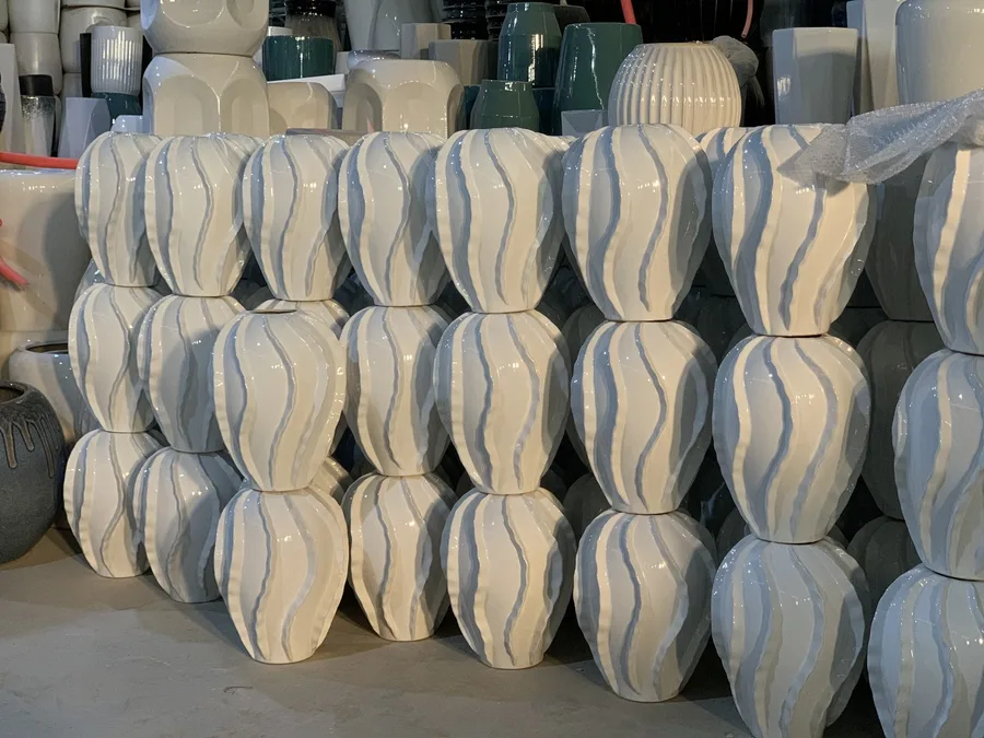 Stacks of ceramic vases in production staging